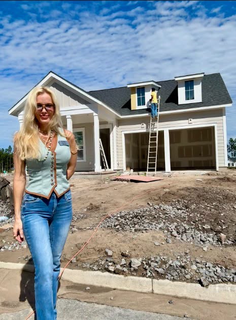 Erica Joy walking a homesite during construction
