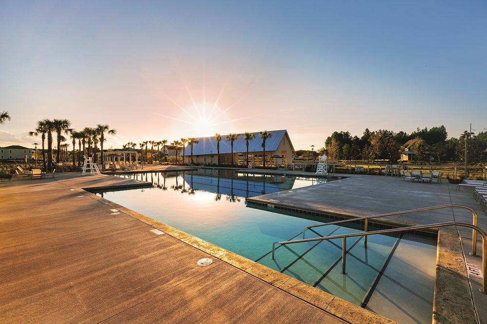 Brighton Park Swim Club pool and clubhouse at sunset
